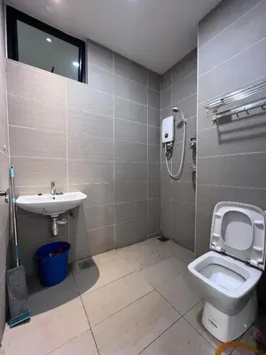 a bathroom with a toilet and a sink at Kuching Town Area Rex apartment in Gua Sai
