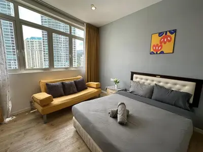 a bedroom with a bed with a stuffed animal on it at Spacious Chill Entire Suites 118Island Plaza in George Town