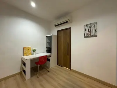 a room with a desk and a wooden door at Spacious Chill Entire Suites 118Island Plaza in George Town