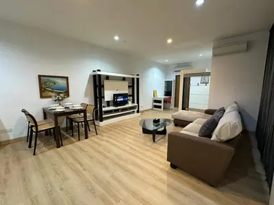 a living room with a couch and a table at Spacious Chill Entire Suites 118Island Plaza in George Town
