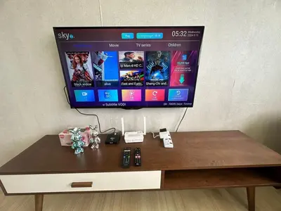 a flat screen tv sitting on top of a table at Spacious Chill Entire Suites 118Island Plaza in George Town