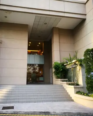 a building with stairs in front of a building at Spacious Chill Entire Suites 118Island Plaza in George Town