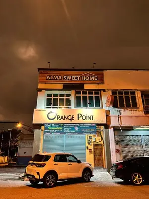a white suv parked in front of a dance point at Alma Sweet Home in Bukit Mertajam