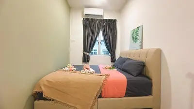 a bedroom with a bed with two dolls on it at 2 Bedroom Townhouse Homestay In Bandar Dato Onn in Gua Sai
