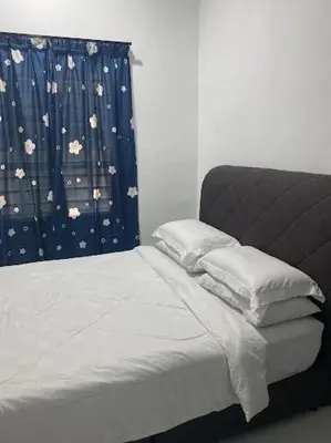 a bedroom with a bed and a window with a curtain at Homestay Aman Berkat in Kampar