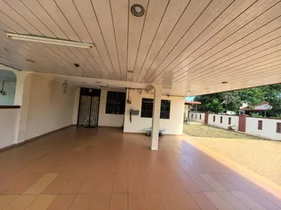 a large room with a wooden ceiling and a wooden floor at Lagenda Serai Wangi Homestay in Padang Serai