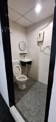 a bathroom with a toilet and a sink at Captain Hotel Cafe & Bistro in Sitiawan