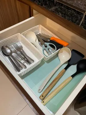 a drawer filled with utensils in a drawer at Lily Studio in Brinchang