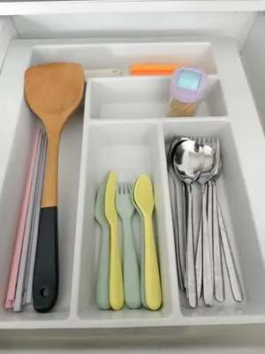 a drawer filled with utensils in a refrigerator at The Sun Executive Suite - Dolphin's Home in Bayan Lepas