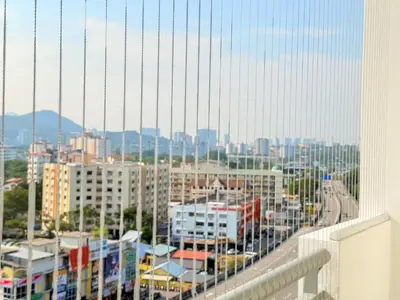 a view of a city from a balcony at The Sun Executive Suite - Dolphin's Home in Bayan Lepas