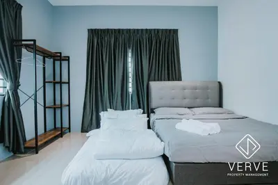 a bedroom with two beds and a window at Ipoh Lazy Private Club House 4B3B by Verve 14 pax in Tambun