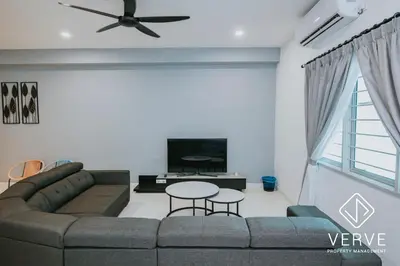 a living room with a couch and a tv at Ipoh Lazy Private Club House 4B3B by Verve 14 pax in Tambun