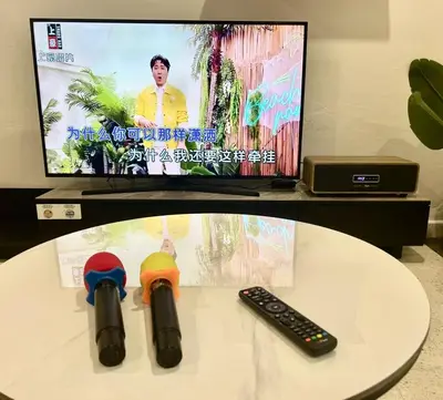 a tv with two stethoscopes and a remote control at Ipoh Lazy Private Club House 4B3B by Verve 14 pax in Tambun