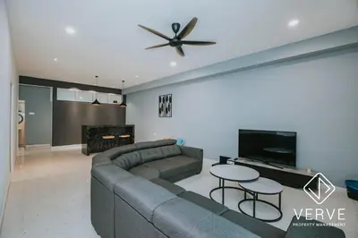 a living room with a couch and a ceiling fan at Ipoh Lazy Private Club House 4B3B by Verve 14 pax in Tambun