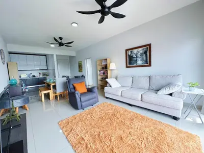 a living room with a couch and a ceiling fan at PPAM Seruling Presint 5, Putrajaya 4BR with PICC View and Garden View Homestay