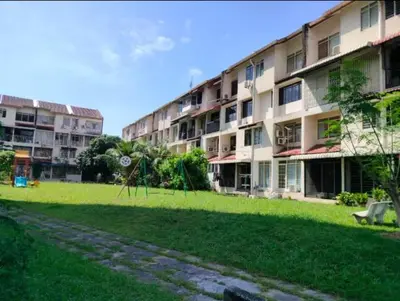 a large apartment building with a park in front of it at Comfy Room Near to Penang Bridge in George Town