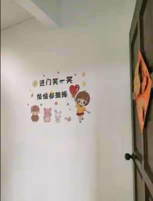 a wall with hello kitty stickers on a wall at Comfy Room Near to Penang Bridge in George Town