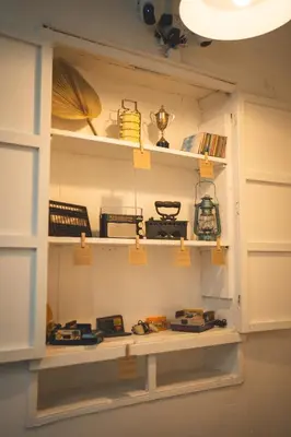 a shelf in a room filled with lots of items at Carnarvon 73 in George Town
