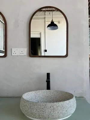 a circular sink in a room with a mirror at Carnarvon 73 in George Town
