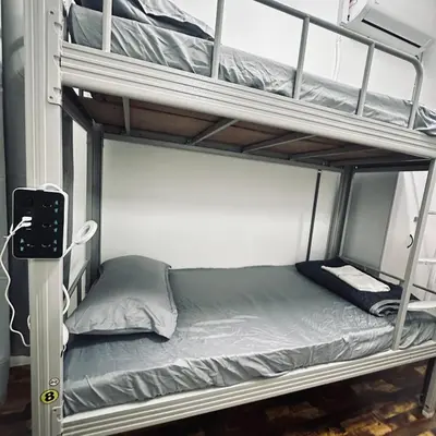 a couple of bunk beds in a room at Hey Rest Up with shared bathroom in Ipoh