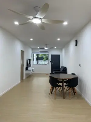 a dining room with a ceiling fan and a table at Ling Dream Home in Sitiawan in Sitiawan