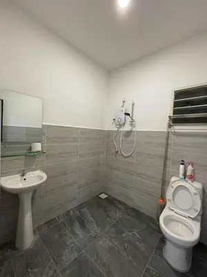 a bathroom with a toilet and a sink at Ling Dream Home in Sitiawan in Sitiawan