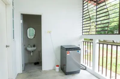 a bathroom with a sink and a toilet in a room at Leavy Haven, Botanica CT, Balik Pulau, Penang in Balik Pulau