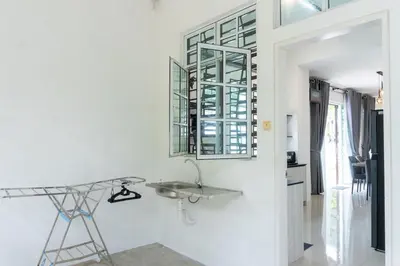 a bathroom with a sink and a mirror on the wall at Leavy Haven, Botanica CT, Balik Pulau, Penang in Balik Pulau