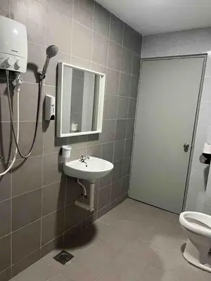 a bathroom with a sink and a shower and a toilet at The Venus Sweet home in Sitiawan