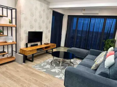 a living room with a couch and a television at The Venus Sweet home in Sitiawan