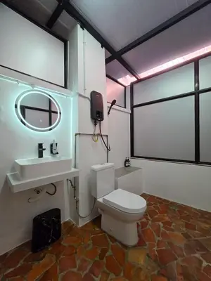 a bathroom with a toilet and a sink and a mirror at New ! 6 Pax Georgetown Heritage Pre-war House 2 Bed Room in George Town