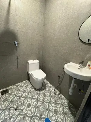 a bathroom with a toilet and a sink at Peruda Inn - Homestay for Múslim only in Sungai Petani