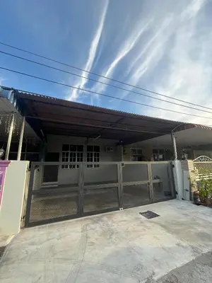 a house with a garage with a gate and a fence at Peruda Inn - Homestay for Múslim only in Sungai Petani