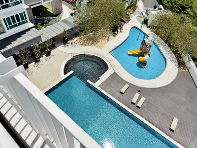 an overhead view of a swimming pool with a slide at D'Festivo Residence Ipoh 3Bdr by PLY Home in Ipoh