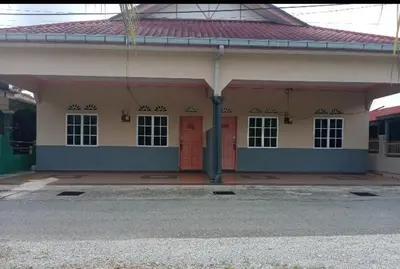 a building with red doors on the side of it at Homestay bonda tanjung malim in Kampong Keteyong