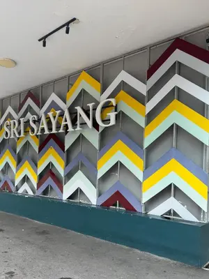 a mural on the side of a building with a samsung sign at Sri Sayang sunset 2 bedroom in Batu Ferringhi