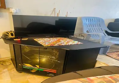 a table with two pizzas on top of it at Robina Homestay in Butterworth