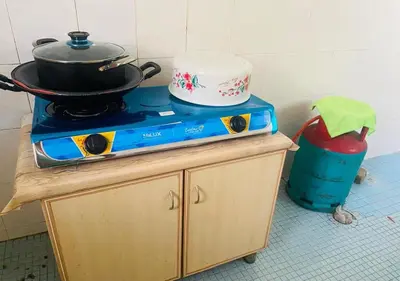 a kitchen with a stove with a pot on it at Robina Homestay in Butterworth