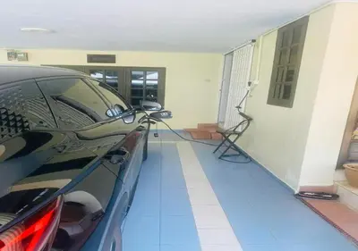a car parked in front of a house at Robina Homestay in Butterworth