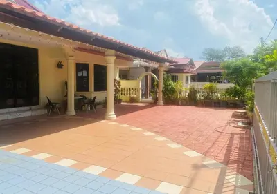 a house with a brick patio in front of it at Robina Homestay in Butterworth