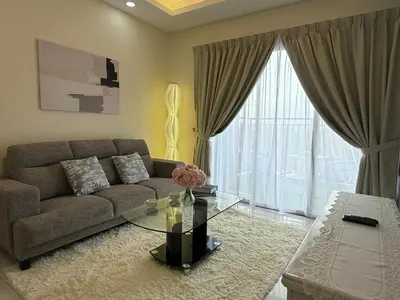 a living room with a couch and a glass table at Cozy 3BR Emerald Avenue Brinchang, 8pax Netflix in Brinchang