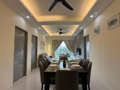 a dining room with a table and a ceiling fan at Cozy 3BR Emerald Avenue Brinchang, 8pax Netflix in Brinchang