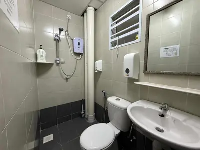 a bathroom with a toilet and a sink at Cozy 3BR Emerald Avenue Brinchang, 8pax Netflix in Brinchang
