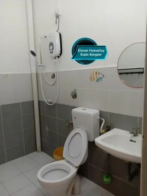 a bathroom with a toilet and a sink at Eleven Homestay Kuala Kangsar in Kuala Kangsar