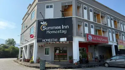 a building with a sign on the side of it at Summer Hotel Kampar Perak in Kampar