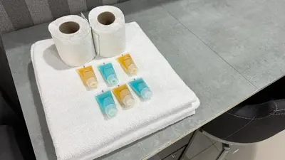 a table with rolls of toilet paper on it at Summer Hotel Kampar Perak in Kampar