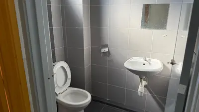 a bathroom with a toilet and a sink at Summer Hotel Kampar Perak in Kampar