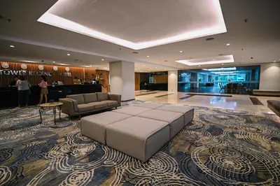 a large lobby with a large ottoman in the middle at Kingston Hotel 15 - Tower Regency, Ipoh in Ipoh