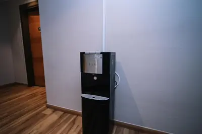 a vending machine in the corner of a wall at Kingston Hotel 15 - Tower Regency, Ipoh in Ipoh