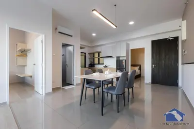 a kitchen and dining room with a table and chairs at Sunshine Residence Suites in Ayer Itam